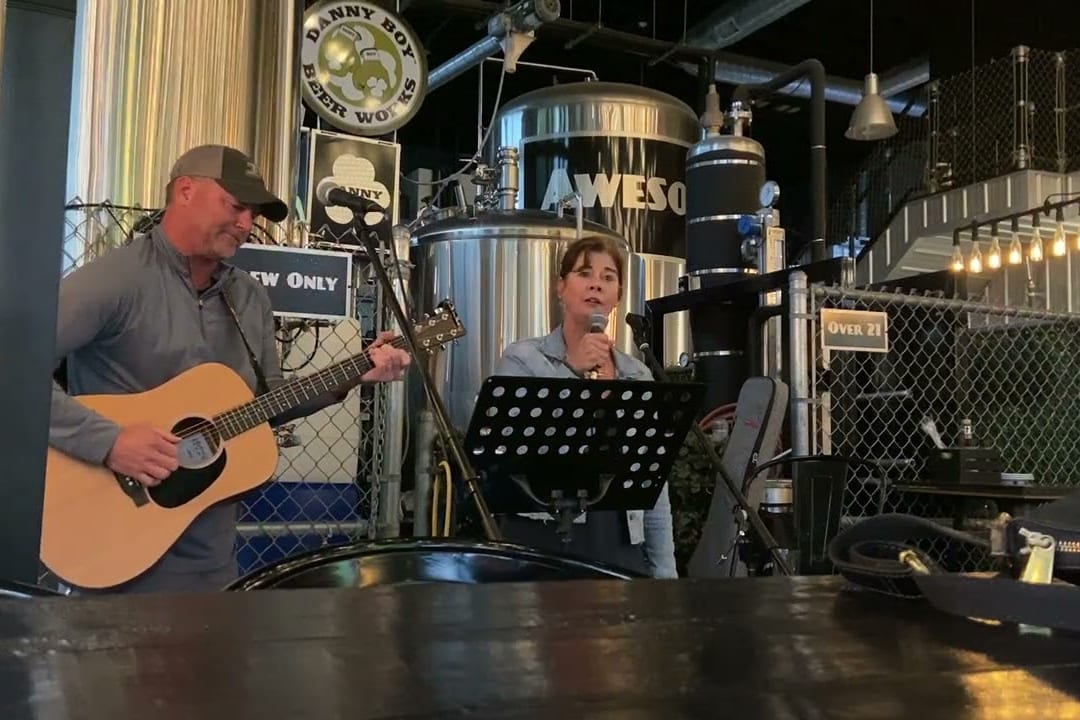 Todd on acoustic guitar and Leah singing at Danny Boy Beer Works in Carmel